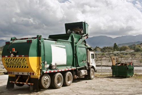 Crew wearing PPE including hi-vis, gloves and safety boots on a business waste job